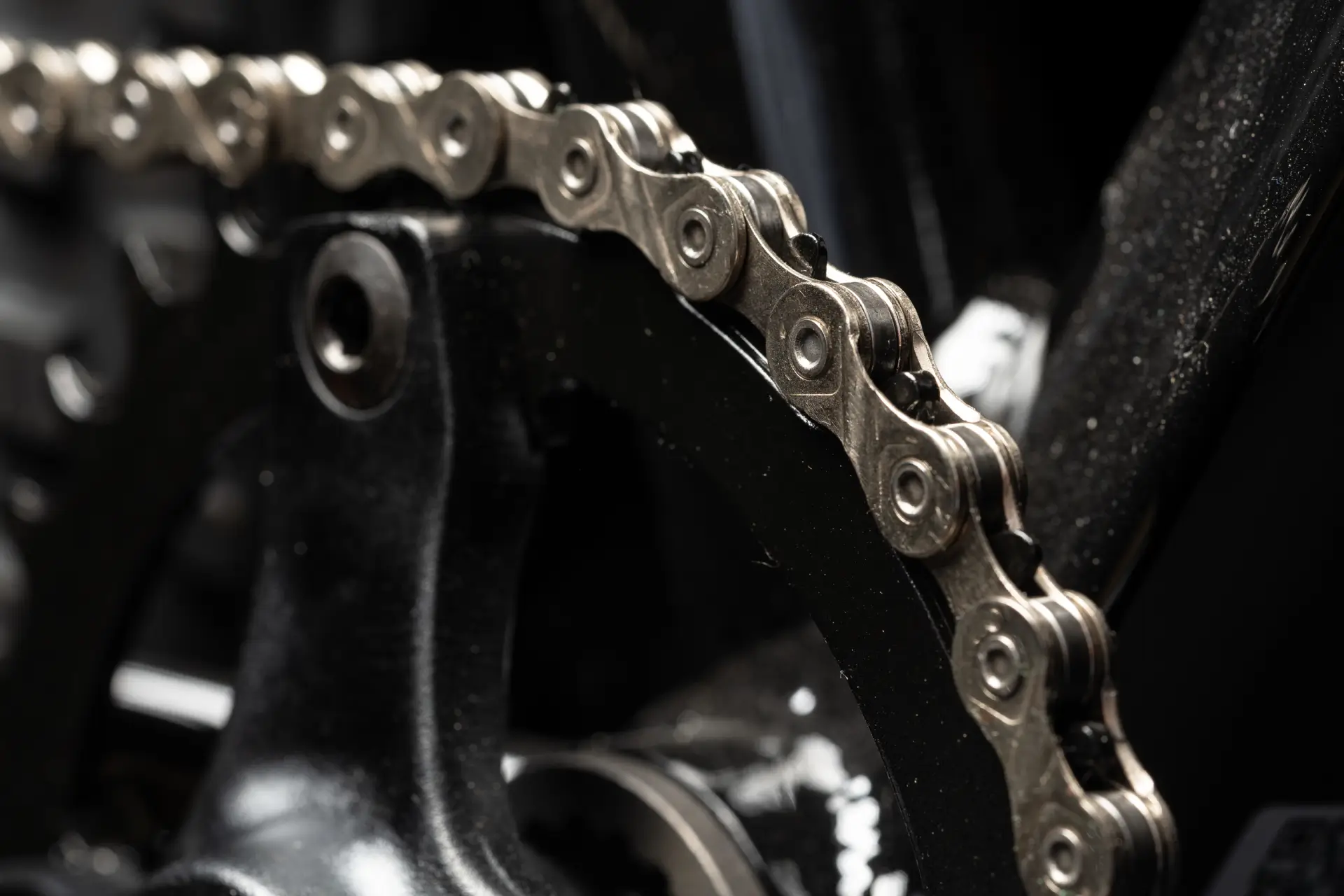 new-bicycle-chain-part-close-up-on-black-backgroun-2026-03-20-00-09-32-utc (1)